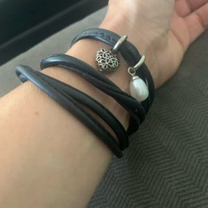 Leather bracelet - story by Kranz and Ziegler. With two charms.